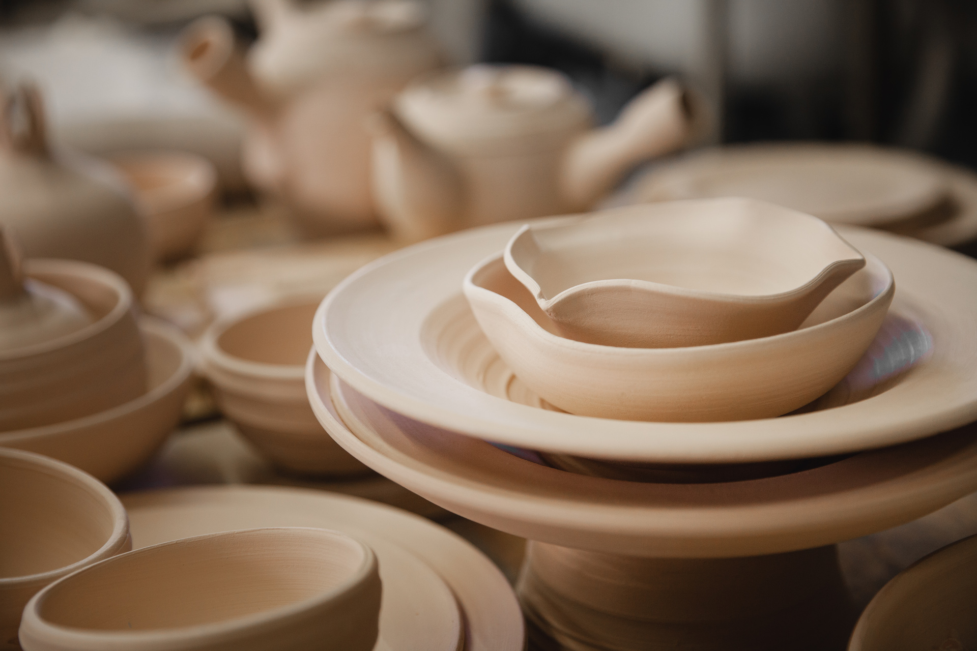 Roasted ceramimc plates without glaze. Front view, closeup. Art and business, hobby and freelance working concept.